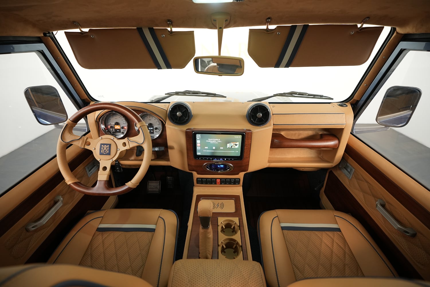 Custom Land Rover Defender with modern drivetrain and luxury interior by Monarch Defender