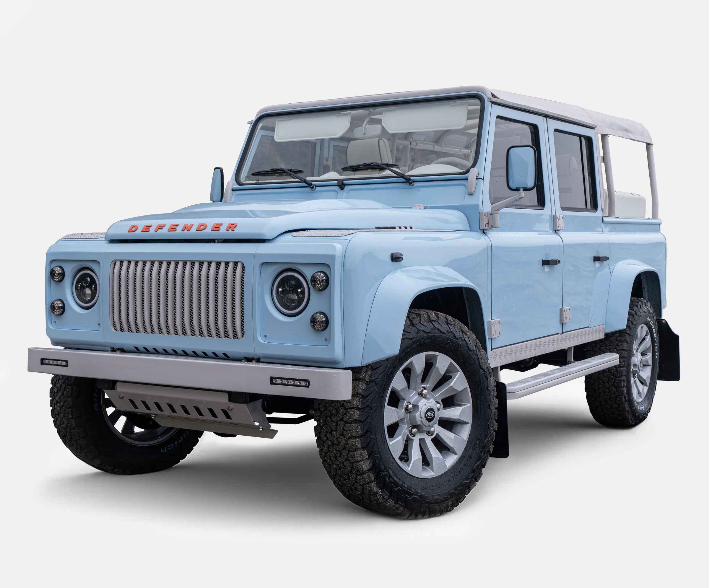 Front view of a custom light blue Land Rover Defender with modern styling